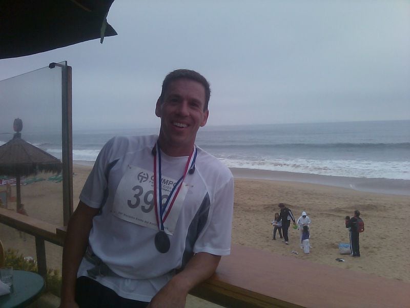 Carl Byington after the Vina del Mar marathon along the Pacific coast in Chile in 2009. This is near the finish line looking out to the Pacific Ocean. CONTRIBUTED BY MIKE ROEMER