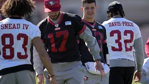 San Francisco 49ers quarterback Brock Purdy, second from right, watches during a practice ahead of the Super Bowl 58 NFL football game Saturday, Feb. 10, 2024, in Las Vegas. (AP Photo/John Locher)