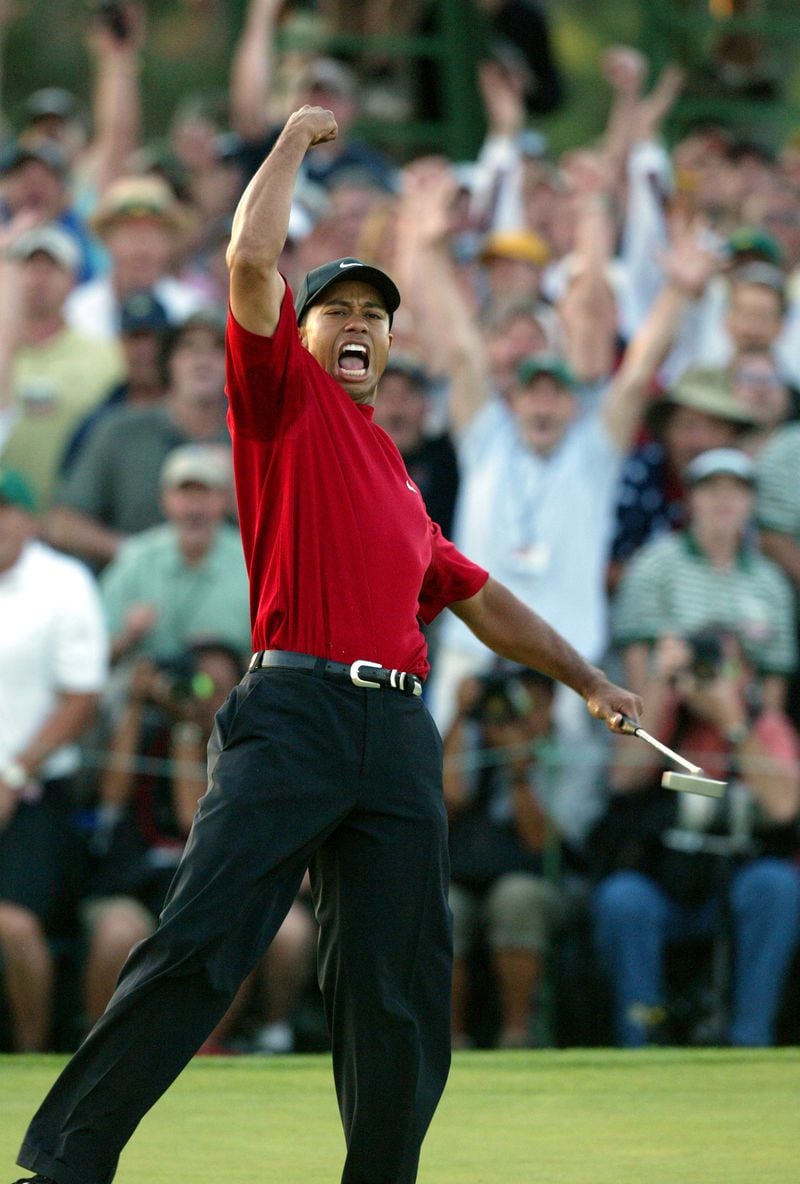 2005 - AUGUSTA, GA -- (FINAL ROUND) - Tiger Woods pumps his fist as he wins the Masters over playing partner Chris DiMarco on the first playoff hole, number 18, during the final round at Augusta National Sunday, April 10, 2005. (PHIL SKINNER/AJC staff)