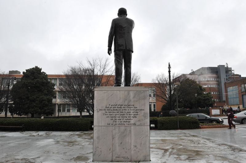 This statute of the Rev. Martin Luther King Jr. stands outside a chapel on Morehouse College’s that bears his name. Morehouse is planning to create a park on campus near the chapel. HYOSUB SHIN / HSHIN@AJC.COM
