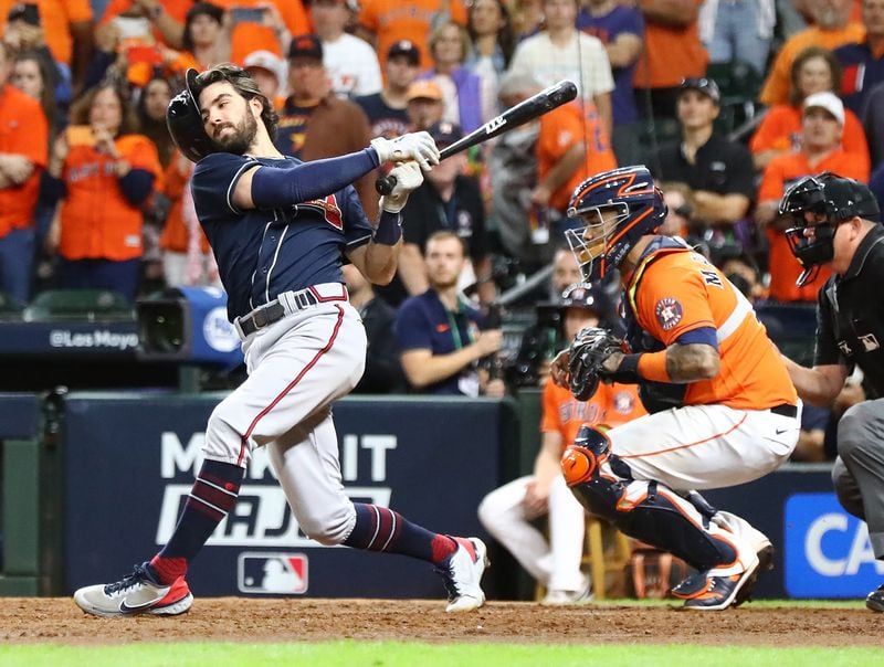 Braves shortstop Dansby Swanson loses his helmet as he strikes out in the 9th inning to end the game in a 7-2 loss to the Astros in game 2 of the World Series on Wednesday, Oct. 27, 2021, in Houston.   “Curtis Compton / Curtis.Compton@ajc.com”