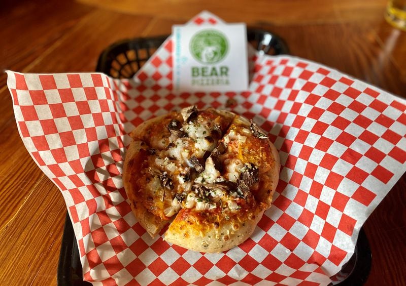 Bear Pizzeria makes vegan pizza, like this toasty, personal-size pie with onion, mushroom and plant-based feta. Wendell Brock for The Atlanta Journal-Constitution