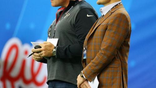 Falcons general manager Thomas Dimitroff and assistant general manager Scott Pioli were spotted together on the sidelines evaluating players during the Chick-fil-A Peach Bowl on Wednesday, Dec. 31, 2014, in Atlanta. It's not clear if Pioli, who has a larger role in the draft, will be made available to the local media leading up to the draft. (Curtis Compton/CCompton@ajc.com)