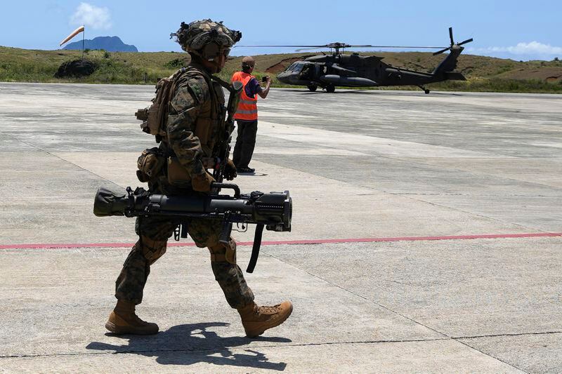 U.S. marines secure an area at the airport of the Philippines' northernmost town of Itbayat, Batanes province during a joint military exercise on Monday, May 6, 2024. American and Filipino marines held annual combat-readiness exercises called Balikatan, Tagalog for shoulder-to-shoulder, in a show of allied military readiness in the Philippines' northernmost town facing southern Taiwan. (AP Photo/Aaron Favila)