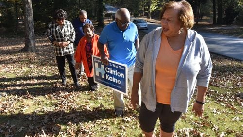 Hillary Clinton supporters (from left) Bertha Tivey, her husband Ronald Tivey, Vivian Baldwin, her husband Ivan Baldwin, and Emma Godbee, walk back to Baldwin’s home in Riverdale on Thursday, November 10, 2016. Hillary Clinton may have lost the presidency and Georgia. But she was embraced by residents of Clayton County, where she received support from 84.5 percent of voters - her highest margin in the state. HYOSUB SHIN / HSHIN@AJC.COM