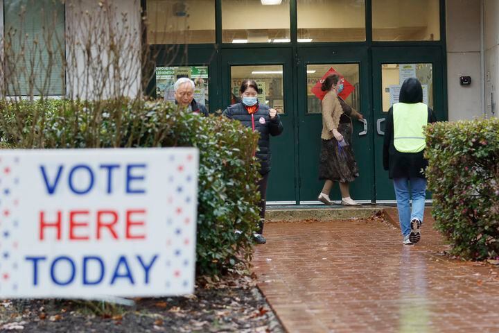 People come in and out at Ashford Park Elementary School during election day on Tuesday, December 6, 2022. Miguel Martinez / miguel.martinezjimenez@ajc.com