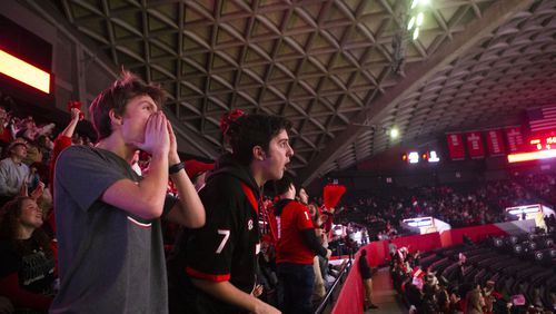 Pieces of concrete are reportedly falling from the ceiling inside Stegeman Coliseum. Reece Moseley (left) and Alex Reiniche (right) are pictured attending a watch party there for the College Football Championship on Monday, January 9, 2023. CHRISTINA MATACOTTA FOR THE ATLANTA JOURNAL-CONSTITUTION.
