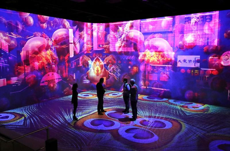 Visitors receive a glimpse of Illuminarium in Atlanta before its scheduled opening date in July. Curtis Compton / Curtis.Compton@ajc.com