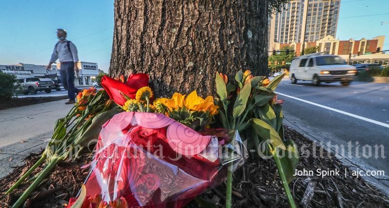 A memorial for Catherine Khan continued to grow at the intersection of Peachtree and Piedmont road days after she was killed there Oct. 10, 2021. 