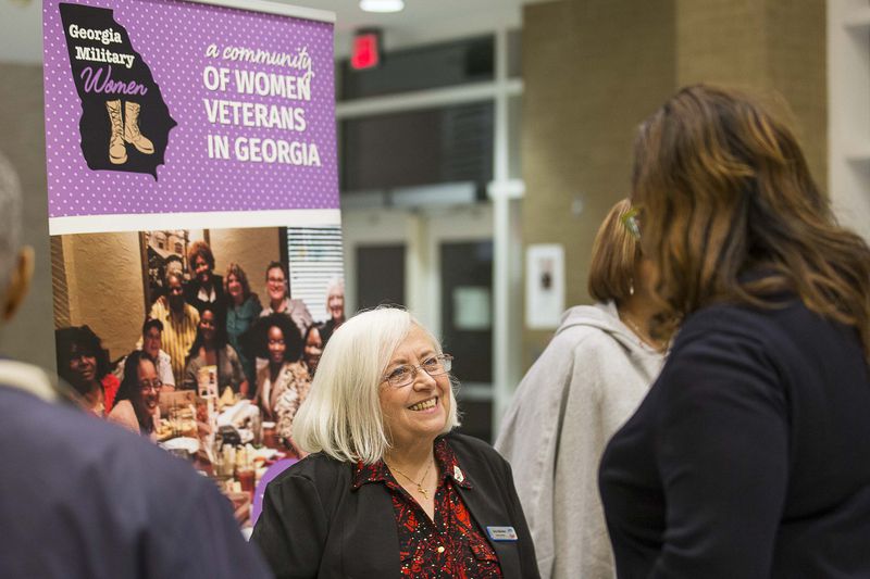 Georgia Military Women's founder and U.S Navy Veteran Amy Stevens (center) speaks with U.S. Army Veteran Nyala Allen in 2019. Stevens says she believes the VA does good medical work, overall, with Georgia veterans. (ALYSSA POINTER/ALYSSA.POINTER@AJC.COM)
