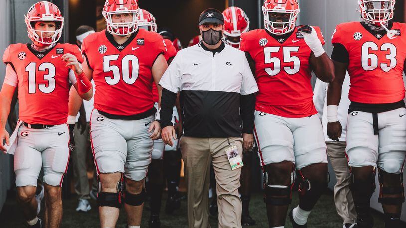 Georgia's director of football operations Josh Lee (center in mask) resigned on Monday amid an EOO investigation into his relationship with employees. (Photo from UGA Athletics)