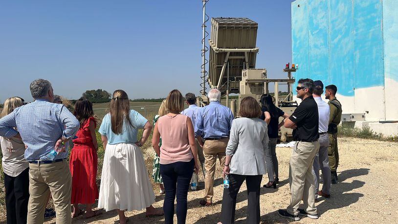 An Israeli soldier briefs Gov. Brian Kemp and members of the Georgia delegation on Israel's antimissile Iron Dome system.