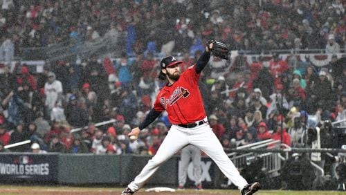 Braves pitcher Ian Anderson delivered to an Astros batter during a soggy Game 3 of the World Series in Atlanta. Anderson's spring start was pushed back to Friday because of inclement weather Thursday in Florida. (Hyosub Shin / Hyosub.Shin@ajc.com)