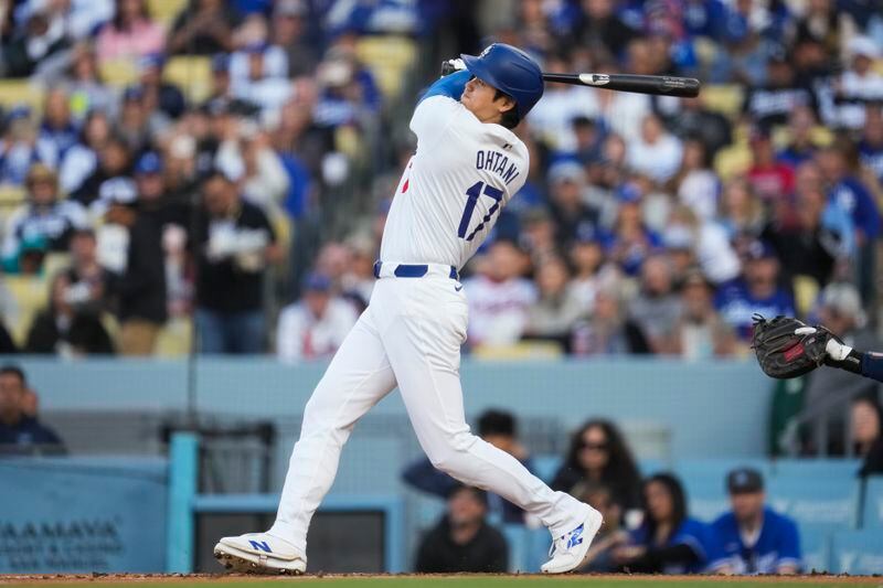 Los Angeles Dodgers designated hitter Shohei Ohtani (17) hits a home run during the third inning of a baseball game against the Atlanta Braves in Los Angeles, Saturday, May 4, 2024. (AP Photo/Ashley Landis)