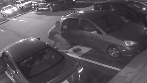 Pictured is an image of an attempted car break-in in Atlanta. Sandy Springs Police say they've seen a spike in car break-ins.