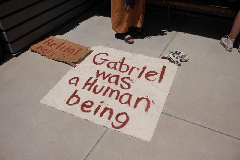 A sign referring to Gabriel Cuen-Buitimea, a Mexican man found dead on the ranch of George Alan Kelly, sits outside the Santa Cruz County Courthouse on Monday, April 29, 2024. Kelly's trial on a charge of second-degree murder ended last week with a deadlocked jury, and prosecutors said Monday during a hearing that they would not retry him. (Angela Gervasi/Nogales International via AP)