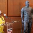 Billye Aaron, Hank Aaron’s widow, looks at the statue of her husband as she speaks during the unveiling of the Hank Aaron statue by the grand staircase at the National Baseball Hall of Fame, Thursday, May 23, 2024, in Cooperstown, NY. (Jason Getz / AJC)
