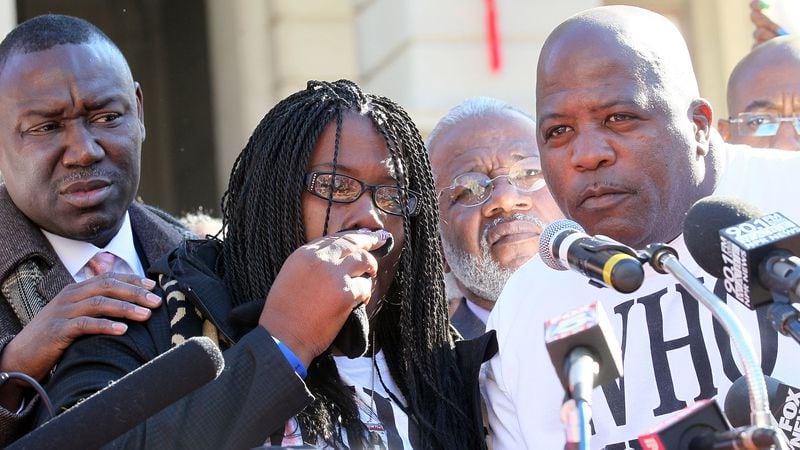 Jackie and Kenny Johnson (center) speak to the crowd during a “Who Killed K.J.” rally for their son Kendrick Johnson in front of the Georgia State Capitol in Atlanta on Dec. 11, 2013. On the left is Benjamin Crump, the family’s co-counsel at the time. PHIL SKINNER / PSKINNER@AJC.COM