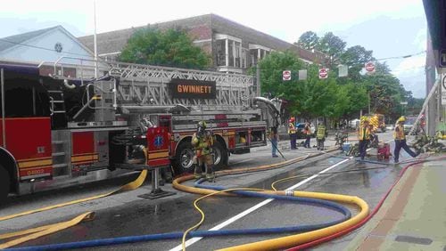 A fire damaged a downtown Lawrenceville gun shop Saturday morning, authorities said.