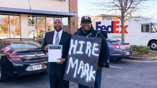 Mark Moore (left) and Terence Lester, founder of the nonprofit Love Beyond Walls, get ready to start the search for a job for Moore. Six days after launching #HireMark, Moore was offered a job. CONTRIBUTED