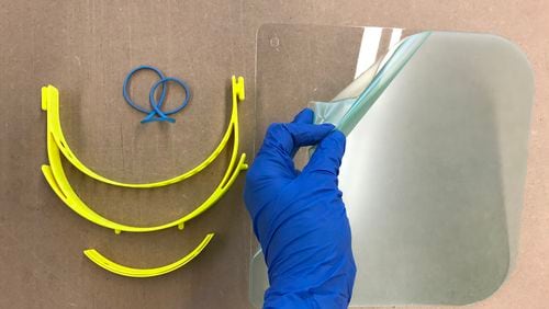 KSU staff members are using a 3D printer and laser cutter in the university’s College of Architecture and Construction Management’s Digital Fabrication Lab to create face shields, which protect healthcare workers’ eyes and face from the virus spread by coughs and sneezes of infected patients.