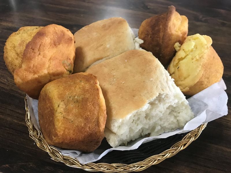 A lunch or dinner at Barbecue Kitchen is not complete without a bread basket filled with its house-made biscuits, corn muffins and Mexican corn muffins. LIGAYA FIGUERAS / LFIGUERAS@AJC.COM