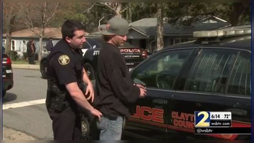 Police arrested and detained several people accused of running a chop shop. (Credit: Channel 2 Action News)