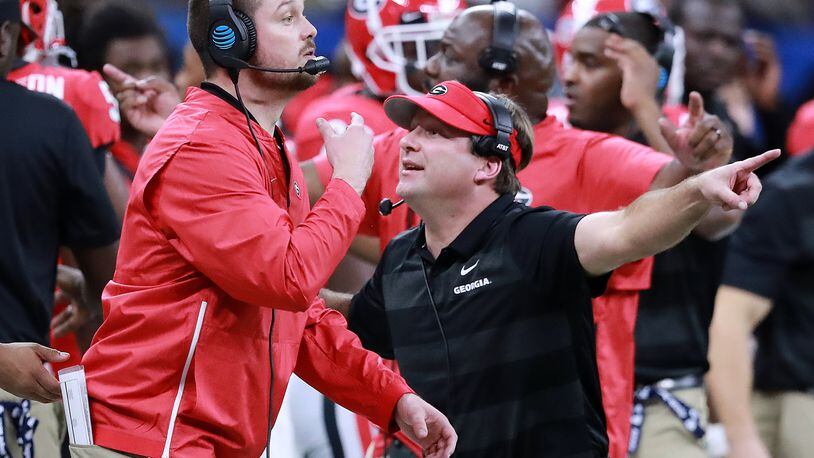 Georgia assistant coach Dan Lanning (left) and head coach Kirby Smart call the defense against Texas during the second half in the Allstate Sugar Bowl at Mercedes-Benz Superdome on Tuesday,  Jan. 1, 2019, in New Orleans.    Curtis Compton/ccompton@ajc.com