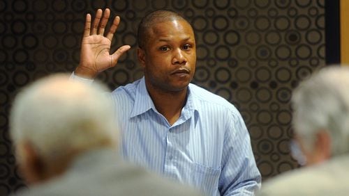 Damany Lewis takes the oath as he is called as a witness in front of a tribunal in 2012. (Bita Honarvar / bhonarvar@ajc.com)