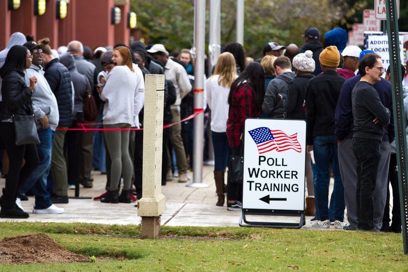 People wait in a long line to vote Saturday at the Cobb County Board of Elections and Registration office in Marietta, GA October 27, 2018. STEVE SCHAEFER / SPECIAL TO THE AJC