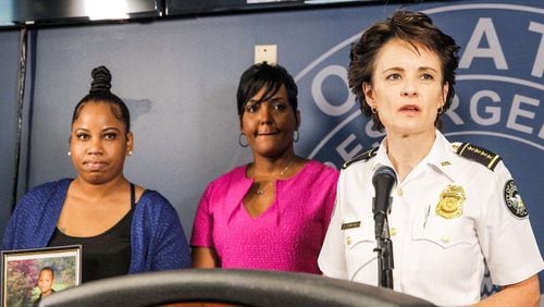 Allison Woods, left, whose son was shot after a football game, appeared with Atlanta Mayor Keisha Lance Bottoms and Atlanta Police Chief Erika Shields to urge the public's help in solving the crime. AJC photo: Alyssa Pointer
