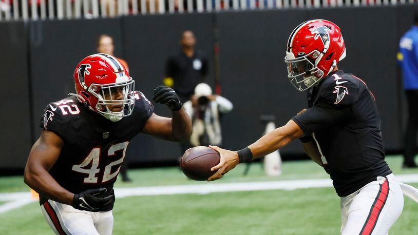 Running back Caleb Huntley (42), who ruptured his Achilles tendon in the Falcons’ 21-18 loss to the Saints, was placed on injured reserve by the Falcons on Tuesday. (Miguel Martinez / miguel.martinezjimenez@ajc.com)
