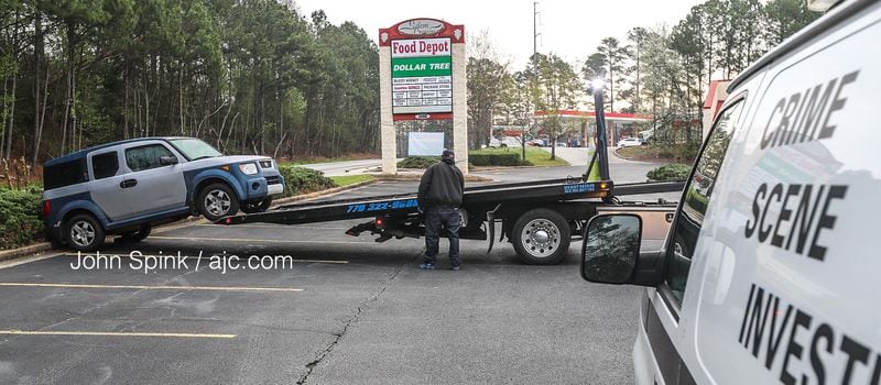The 24-year-old victim was found inside a gray Honda Element parked near the entrance to the shopping center. The vehicle was towed away Wednesday morning.