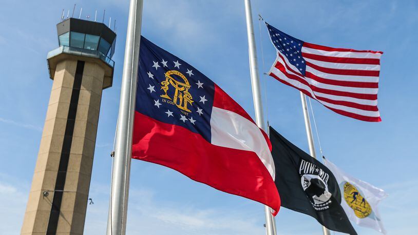 Flags were at half-staff at DeKalb-Peachtree Airport on Mon., May 16, 2016, after a deadly crash at the Good Neighbor Day Air Show. JOHN SPINK / JSPINK@AJC.COM