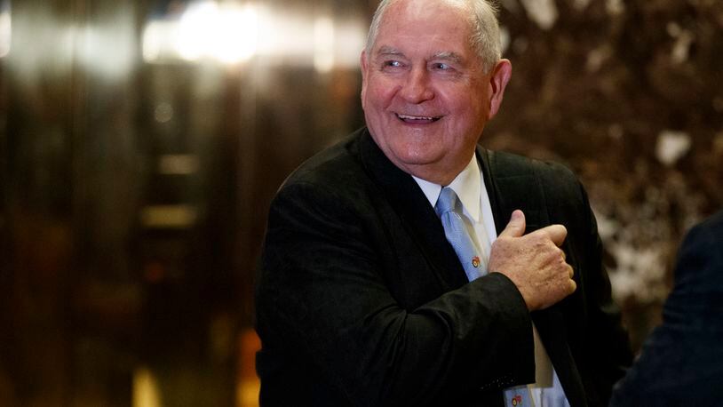 Former Georgia Gov. Sonny Perdue smiles as he waits for an elevator in the lobby of Trump Tower in New York. (AP Photo/Evan Vucci, File)