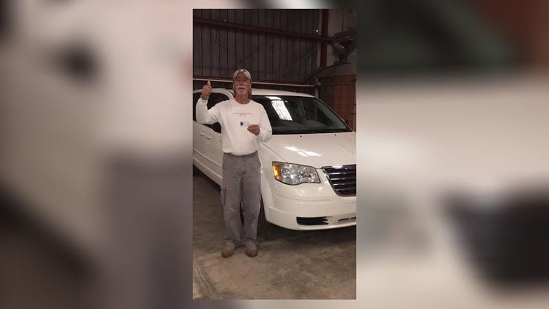 Gregg Ellis poses with his 2009 Chrysler Town and Country gifted to him by members of the community and coworkers at The Rome Athletic Club.