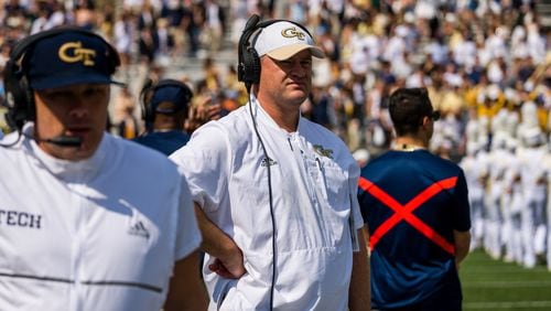 Georgia Tech interim coach Brent Key (white cap) stands on the sideline at the Yellow Jackets' game vs. Ole Miss Sept. 17, 2022 at Bobby Dodd Stadium. It proved the final home game as head coach for Geoff Collins (foreground). (Danny Karnik/Georgia Tech Athletics)