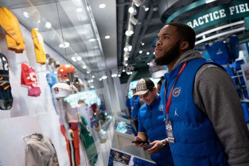 In this file photo, University of Florida players visited the College Football Hall of Fame before competing against the University of Michigan.  