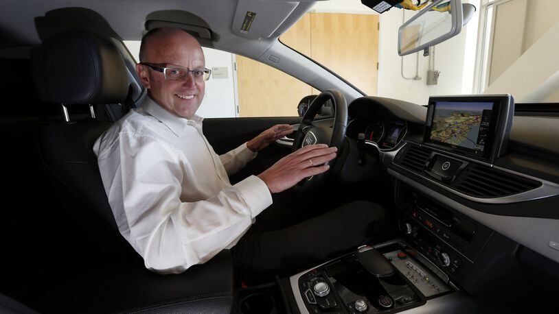 Ewald Goessmann, executive director at the Volkswagen Group Electronics Research Laboratory, shows off an autonomous Audi A7 under development Monday afternoon, March, 30, 2015, in Belmont, Calif. (Karl Mondon/Bay Area News Group/TNS)
