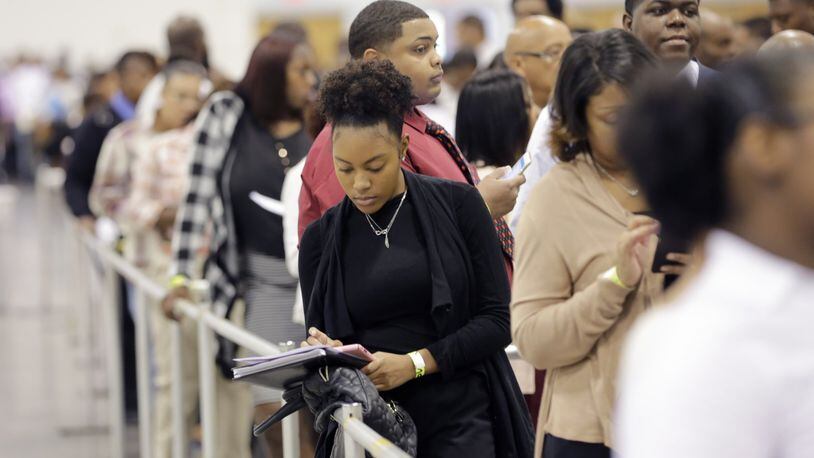 The city is joining with a private sector group for a job fair on May 3. Experts say that a disproportionate share of young people are not in the labor market. Here, a job fair in 2016. BOB ANDRES /BANDRES@AJC.COM