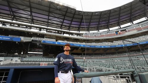 Braves outfielder Ender Inciarte takes in his new home from the dugout while the team holds its first workout at SunTrust Park on Thursday. Curtis Compton/ccompton@ajc.com