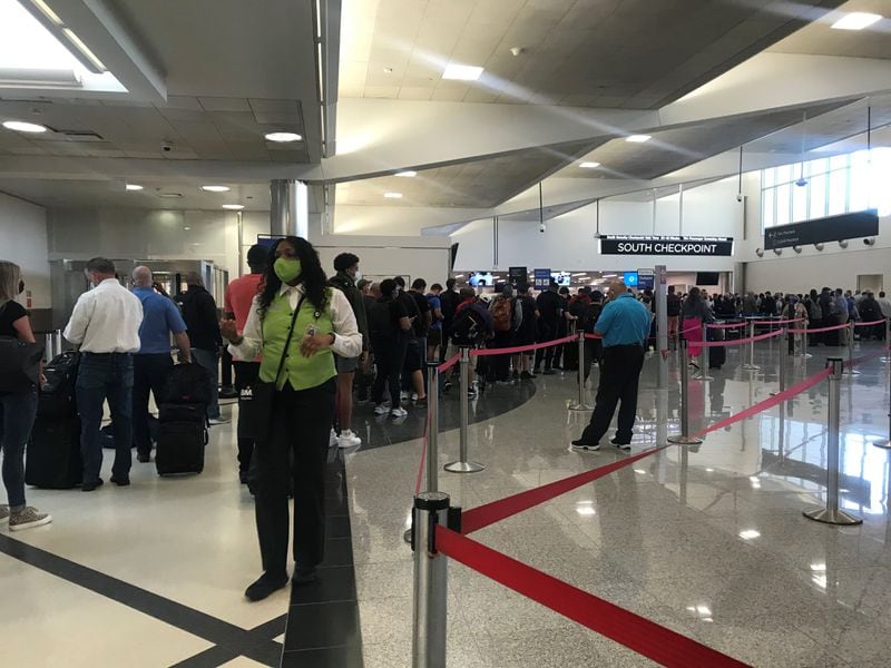 Although the airport's new South security checkpoint was built with lots of space for queueing, the line spilled out into a hallway.