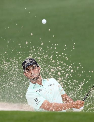 April 10, 2021, Augusta: Abraham Ancer hits his third shot out of the bunker on the second green during the third round of the Masters at Augusta National Golf Club on Saturday, April 10, 2021, in Augusta. Curtis Compton/ccompton@ajc.com