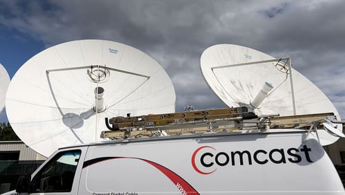A Comcast truck is parked at one of  the cable giant’s centers in Pompano Beach, Florida. The company announced it’s launching a new service, Xfinity Mobile.