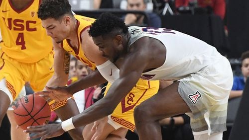 LAS VEGAS, NV - MARCH 10:  Jordan Usher #1 of the USC Trojans steals the ball from Deandre Ayton #13 of the Arizona Wildcats during the championship game of the Pac-12 basketball tournament at T-Mobile Arena on March 10, 2018 in Las Vegas, Nevada. The Wildcats won 75-61.  (Photo by Ethan Miller/Getty Images)