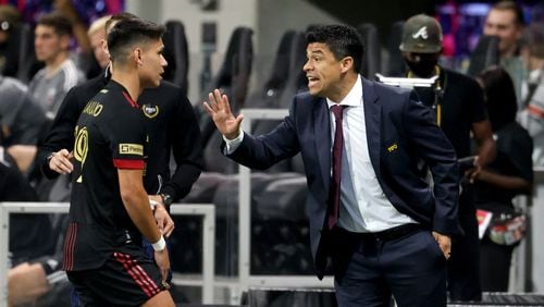 Atlanta United head coach Gonzalo Pineda makes a point to Luis Araujo during a September match against D.C. United.. JASON GETZ FOR THE ATLANTA JOURNAL-CONSTITUTION