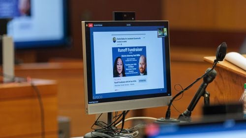 An advertisement for a runoff fundraiser featuring Fulton County District Attorney Fani Willis and lieutenant governor candidate Charlie Bailey is seen on monitors at the Fulton County Superior Court on Thursday, July 21, 2022. (Arvin Temkar / arvin.temkar@ajc.com)