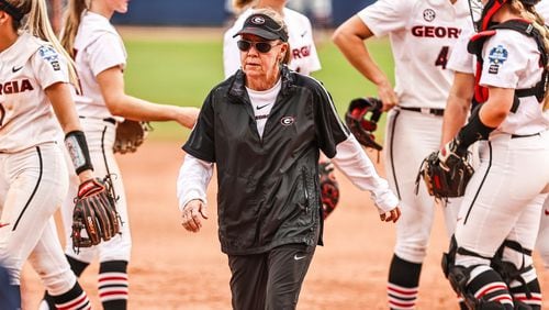 Georgia softball coach Lu Harris-Champer walks away from her team after a pitching mound meeting during the Oklahoma game at the 2021 Women’s College World Series Saturday, June 5, 2021, at USA Softball Hall of Fame Stadium in Oklahoma City, Okla. (Tony Walsh/UGA Athletics)