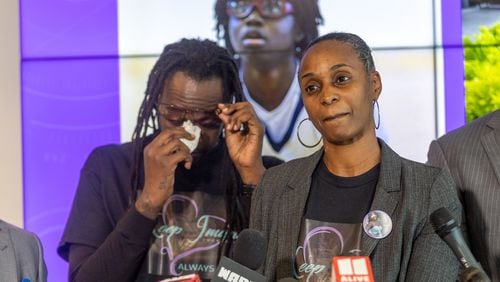Eric Bell becomes emotional as his wife Dorian Bell speaks at a press conference after the family reached a settlement with Clayton County over their daughter's death Tuesday, Nov. 29, 2022. (Steve Schaefer/steve.schaefer@ajc.com)