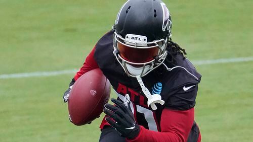 Falcons running back Todd Gurley II (21) runs after a catch during a training camp practice Sunday, Aug. 23, 2020, in Flowery Branch. (John Bazemore/AP)